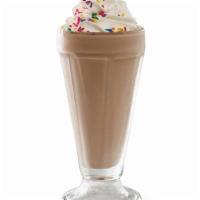 Chocolate Shake · Creamy soft-serve blended with milk and chocolate syrup. Garnished with whipped cream and ra...