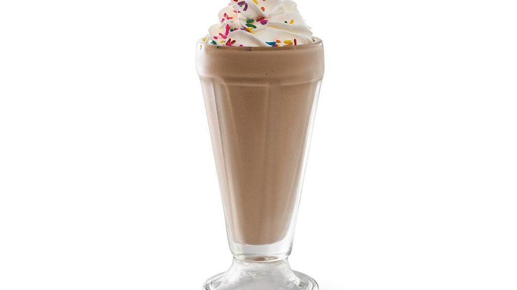 Chocolate Shake · Creamy soft-serve blended with milk and chocolate syrup. Garnished with whipped cream and rainbow sprinkles.