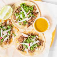 Tacos · Your choice of meat in corn tortilla with cilantro, onion, salsa fresca.