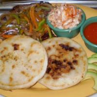 Pupusa Plate · 2 pupusas with steak and onions.