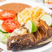 Fried Tilapia · Served with rice, beans and green salad.