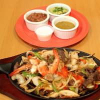 Sizzling Fajitas · Steak, chicken or shrimp with flour tortillas, pico de gallo, guacamole, sour cream, salsa, ...
