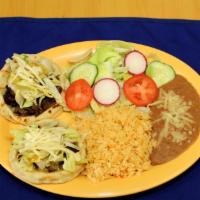 Sopes (2) · Choice of meat with lettuce, refried beans, salsa fresca, avocado. Served with rice, beans a...