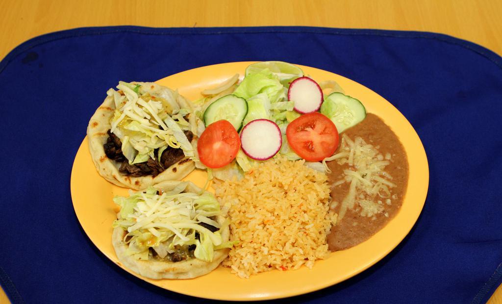 Sopes (2) · Choice of meat with lettuce, refried beans, salsa fresca, avocado. Served with rice, beans and green salad.