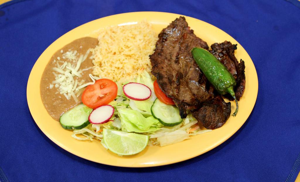 Carne Asada · Steak. Served with rice, beans and green salad.