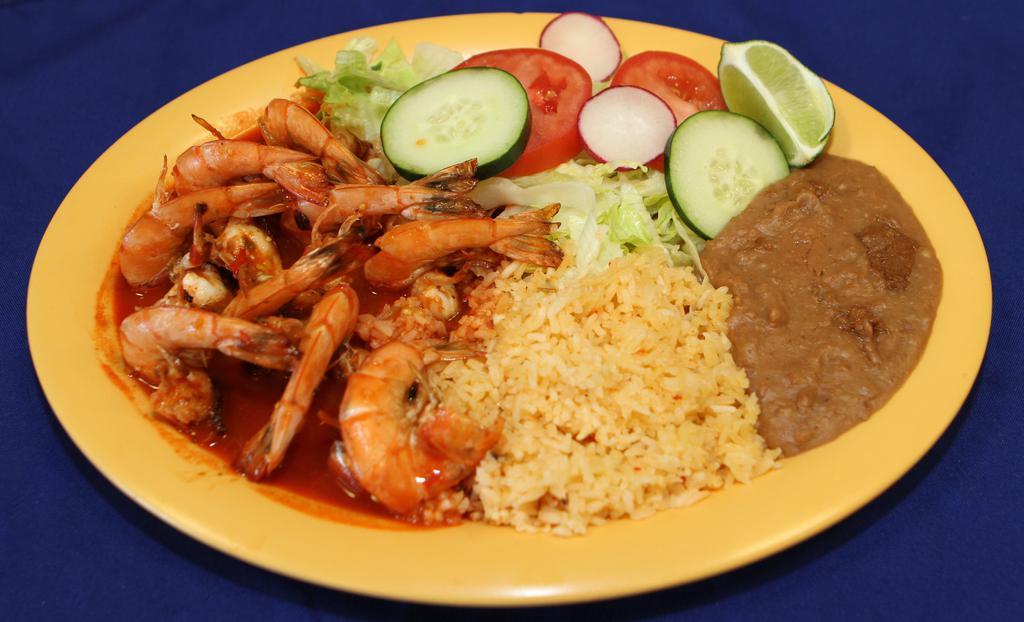 Camarones A La Diabla · Prawns in spicy red sauce. Served with rice, beans and green salad.