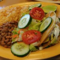 Crispy Tacos (2) · Choice of meat on fried corn tortilla with cilantro, onions, salsa fresca. Served with rice,...