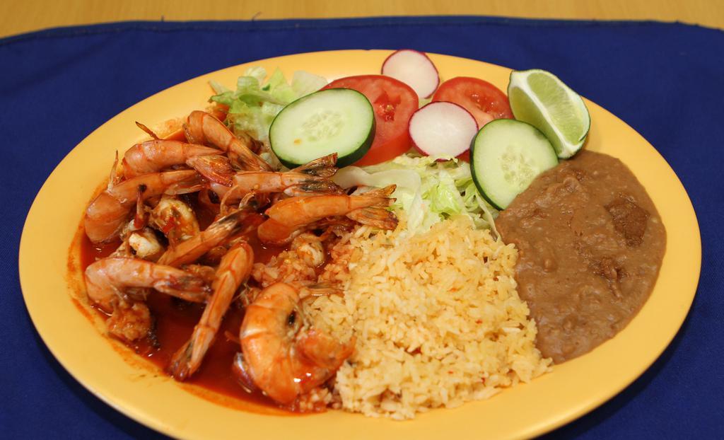 Camarones Grandes A La Plancha · Grilled prawns. Served with rice, beans and green salad.