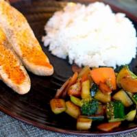 Salmon Hibachi · North Atlantic salmon filets cooked with lemon. . Served with white rice, seasonal vegetable...