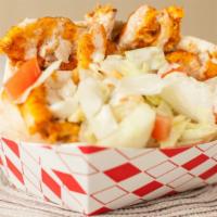 Chicken in a Pita · Tender chicken breast seasoned with spices and topped with lettuce, cucumbers, tomatoes, gri...