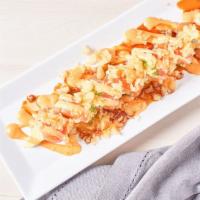 18. Mango Crunch · IN : spicy crab, mango  /  OUT : salmon, avocado, tempura crumble & sauce