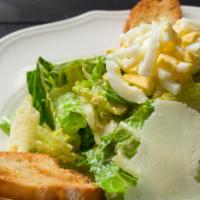 Cesarina · Romaine hearts, hardboiled egg, Grana Padano & croutons with Caesar dressing
