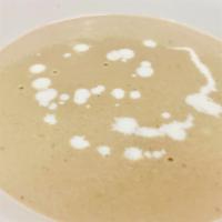 Mushroom Cappuccino Soup · Button mushroom pure thick cream and finishes with truffle oil.