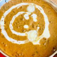 Dal makhani · Rich creamy slow cooked in black lentil with tomato puree, butter and cream.