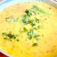 Ghar Ki Dal · Yellow lentil cooked in cumin, garlic, chili and spices.