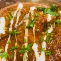 Lamb Vindaloo · A tangy, spicy curry with fresh spices, potato, garlic and tomato.