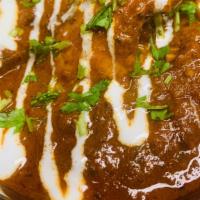 Goat Vindaloo · Goat, tangy spicy, curry with house spices.