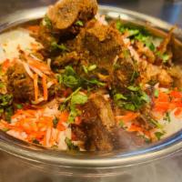 Dum Gosht Biryani · Pieces of goat meat cooked in flavor basmati.