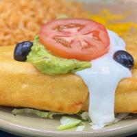 Flautas · Two crisp corn tortillas filled with shredded beef or chicken. Topped with guacamole and sou...