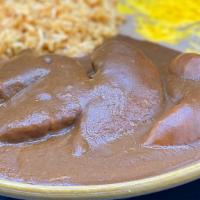 Chicken Mole (Mild) · Boneless chicken breast simmered in a sauce of red chili, peanuts, cocoa, sesame seeds and s...