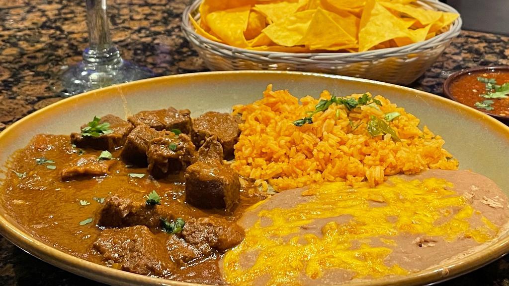 Chile Colorado · Bite-size pieces of steak simmered in a red chili sauce. Served with tortillas.