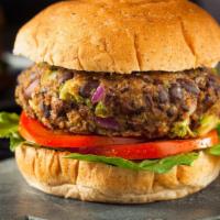 Veggie Burger · Delicious Veggie Burger freshly prepared and cooked to perfection. Topped with lettuce, toma...