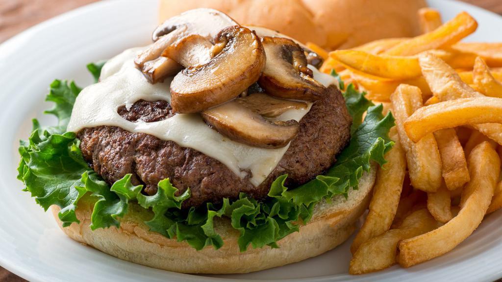 Mushroom Cheeseburger · Delicious Cheeseburger freshly prepared and cooked to perfection. Topped with melted cheese, mushrooms, lettuce, pickles, onions, tomatoes, thousand island dressing, and mayo.