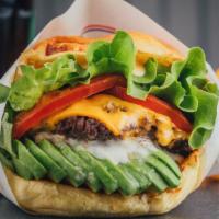 Avocado Cheeseburger · Delicious Cheeseburger freshly prepared and cooked to perfection. Topped with melted cheese,...