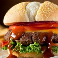 Texas Beef Burger · Delicious Texas Burger freshly prepared and cooked to perfection. Topped with sautéed bell p...