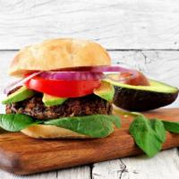 Veggie Avocado Burger · Delicious Veggie Burger freshly prepared and cooked to perfection. Topped with lettuce, toma...