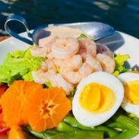 Lake Chalet Louie with Poached Shrimp · Garden lettuces, lemon vinaigrette, citrus, tomato, avocado, boiled egg, louie dressing and ...