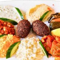 Appetizer Combo · Combination of hummus, dolma, babaganoush, falafel, chacik and ezme. (Vegetarian)