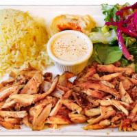  Chicken Gyro Plate · Marinated chicken leg cooked on vertical rotisserie and sliced into thin pieces as it cooks.