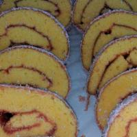 Ninos · rolled yellow cake with lemon, raspberry coconut