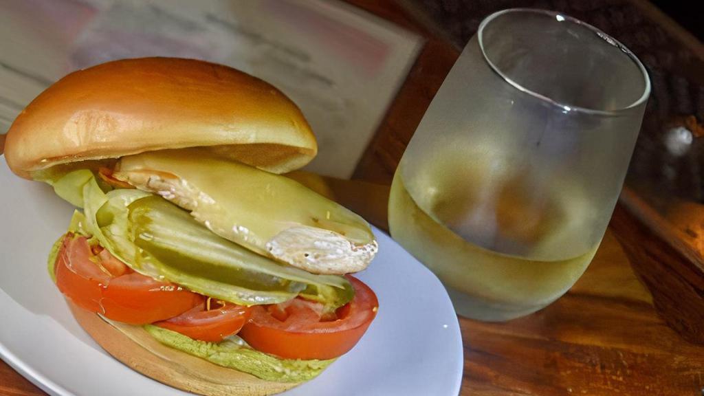 Cali Chicken Sandwich · seasoned chicken breast, pepper jack cheese, avocado dressing, lettuce, tomato, pickles on a brioche bun