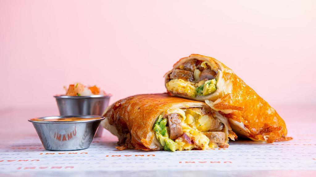 Breakfast Burrito · Warm Flour Tortilla filled with Scrambled Eggs, Bacon, Sausage, Queso Fundido, Breakfast Potatoes and Guacamole served with Red Chile Sauce and topped with Crispy Cheese