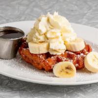 Kid's Waffle · This kids special features a Belgian Waffle topped with Whipped Cream, Powdered Sugar, Fresh...
