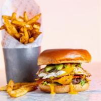 Brunch Sunnyside Burger · 4oz smash patty, bacon strips, fried egg, truffle aioli, tomato spread, lettuce, american ch...