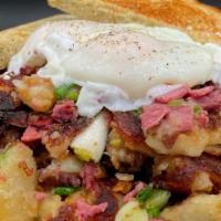 Corned Beef Hash · Chopped corned beef, breakfast potatoes, green onions, topped with two poached eggs