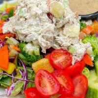 Chicken Salad Salad · Cashew chicken salad on top of crunchy veggies, mixed greens, tomato, cucumber, croutons, se...