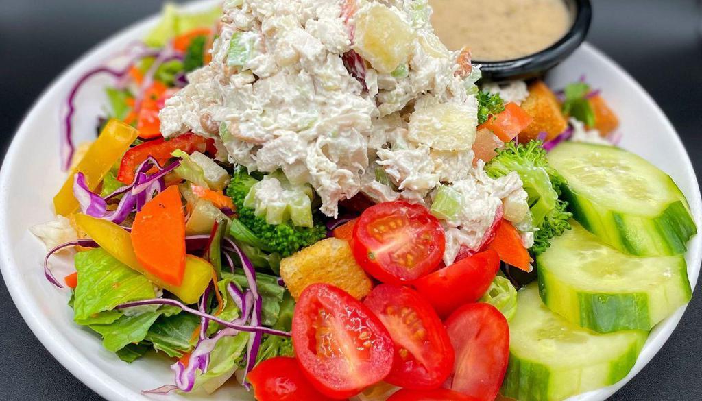 Chicken Salad Salad · Cashew chicken salad on top of crunchy veggies, mixed greens, tomato, cucumber, croutons, served with Italian dressing