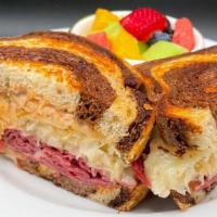 Reuben Sandwich (Hot) · Corned beef, sauerkraut, Swiss cheese, thousand island dressing, served on grilled marble rye