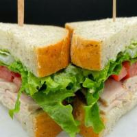 Roasted Turkey Sandwich · Fresh roasted turkey breast, lettuce, tomato & mayo on herb bread