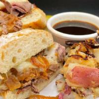 Roast Beef Sandwich (Hot) · Roast beef, caramelized onions & Swiss cheese served on a toasted soft roll, served with au ...