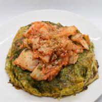 Kimchi Okonomiyaki · Pork kimchi, sriracha sauce.