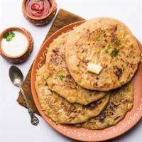 Aloo Paratha · Bread stuffed with spices, potato and cooked with butter in a special Indian pan.