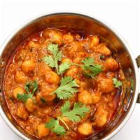 Aloo Chana (with Rice) · Potato and garbanzo beans cooked with fresh onions, tomato sauce and homemade spices. Served...