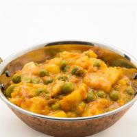 Aloo Veg (with Rice) · Satisfying chickpeas with potato, mixed green vegetables cooked in a curry sauce with homema...