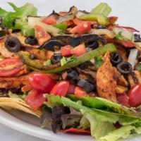 Chicken Fajita Salad · Grilled chicken with grilled onions and bell peppers on a bed of lettuce and salsa fresca.