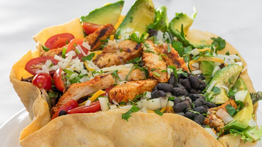 Baja Salad · Flour shell with lettuce, black beans, chicken breast, avocado, salsa fresca, cilantro, cheese and olives.
